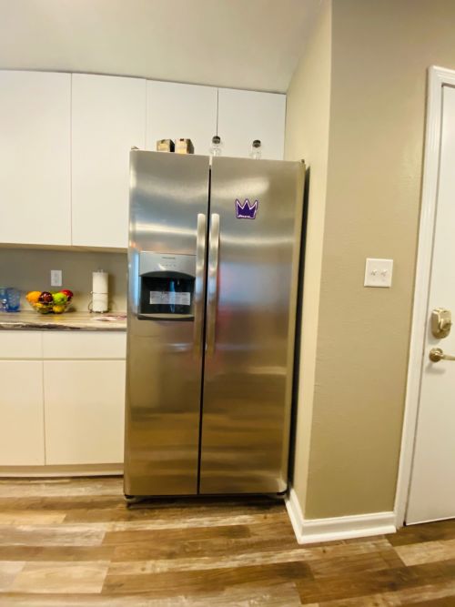 Kitchen and Countertops with Modern Fridge  